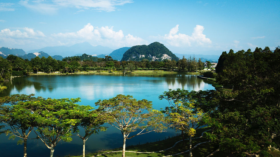 Peaceful lake with mountains and trees reflected in water