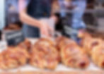 Ten cinnamon buns in a bakery shop