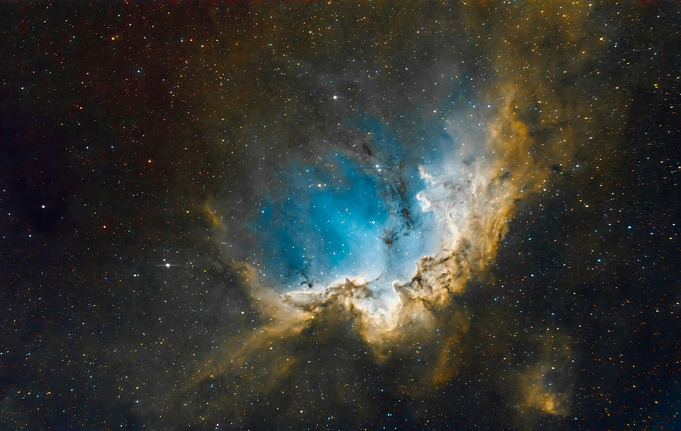 Bright nebula with swirling blue and yellow clouds in a starry night sky, evoking a sense of wonder and vastness. No text.