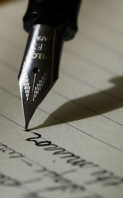 Pen Writing on Paper