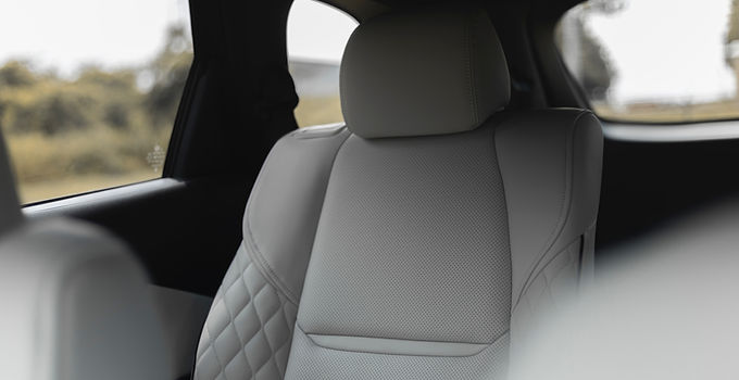 Cream leather back car seat with diamond stitching
