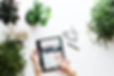 Image by Brooke Lark of woman's hands looking at iPad