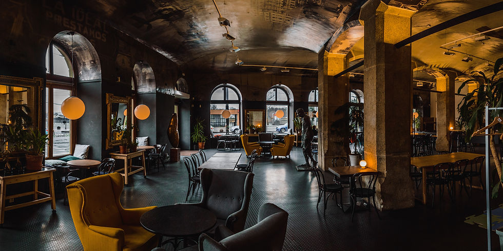 Picture a cozy Italian café with soft lights, vintage books, and colorful ceramics. Wooden tables hold coffee-sipping patrons