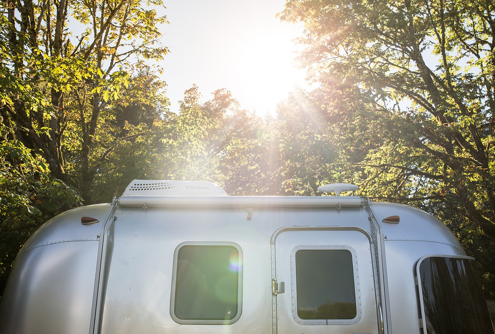 Sunset over a smal airstream.