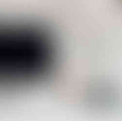 Silver computer positioned elegantly on a clean white table, symbolizing the harmony between technology and wellness in a contemporary digital sanctuary, adorned with minimalist decor and serene ambiance.