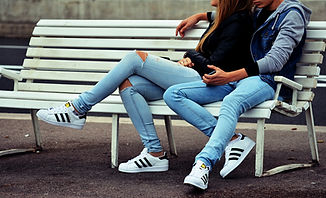 couple sitting outside on a bench
