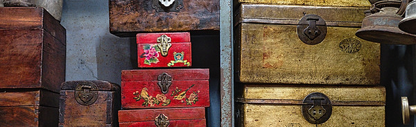 Antique wooden storage containers used to illustrate the EMDR container exercise, a visualization technique for storing and setting aside distressing thoughts or memories.