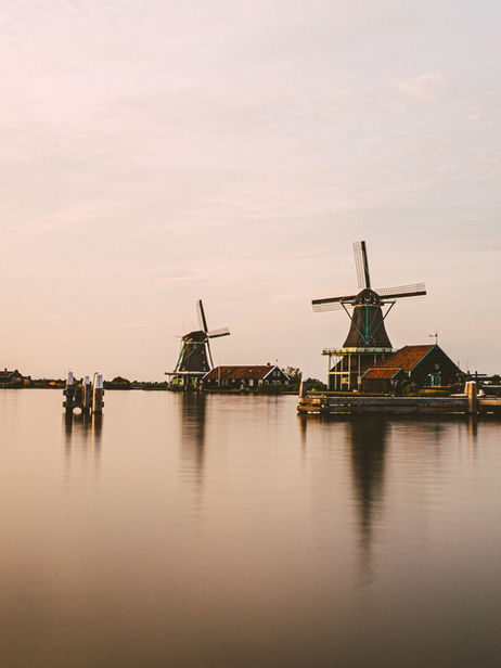 netherlands-windmills-water-reflection-sunset