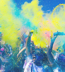 Colour spraying on people at a party