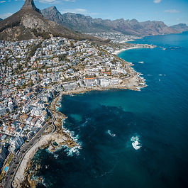 ITINERARY

Day 1: - OVERNIGHT FLIGHT TO SOUTH AFRICA

Day 2: - ARRIVE IN CAPE TOWN. Arrive in Cape Town and transfer to your hotel for check-in. Spend the evening settling in and soaking up the atmosphere of this vibrant city at the foot of Table Mountain. (Meals on your own)

Day 3: - CAPE TOWN CITY TOUR & WELCOME DINNER. After breakfast, explore the best of Cape Town on a guided city tour. Visit the steampunk-inspired Truth Coffee for a unique coffee experience before heading up Table Mountain (weather permitting) for breathtaking views. Enjoy a leisurely afternoon at the bustling Waterfront. In the evening, delight in a welcome dinner with an interactive drumming session at Gold Restaurant. (Breakfast, Dinner)

Day 4: - CAPE PENINSULA ADVENTURE. Today, embark on a scenic full-day tour of the Cape Peninsula. Travel along the Atlantic Seaboard, passing through Hout Bay and along the stunning Chapman’s Peak Drive. Stop for lunch in Simon’s Town before visiting the penguins at Boulders Beach. Continue to the dramatic cliffs of Cape Point, and finish the day with a delightful wine tasting at Cape Point Vineyards. Enjoy a special private dinner at The Food Barn, paired with local wines. (Breakfast, Lunch, Dinner)

Day 5: - WINELANDS EXPLORATION. Immerse yourself in the world-famous Cape Winelands on a full-day tour. Visit two prestigious wine estates for tastings and enjoy a leisurely lunch at one of the estates. Explore the charming towns of Stellenbosch and Franschhoek in the afternoon. End the day with an overnight stay in the picturesque Winelands. (Breakfast, Lunch)

Day 6: - JOURNEY TO OUDTSHOORN. After breakfast, depart for Oudtshoorn, South Africa's ostrich capital. Enjoy a unique ostrich tour and lunch on arrival. In the afternoon, explore the fascinating underground wonder of the Cango Caves. Overnight in Oudtshoorn. (Breakfast, Lunch)

Day 7: - KNYSNA & FEATHERBED CRUISE. Depart Oudtshoorn and travel to the charming town of Knysna. Enjoy a delicious lunch followed by the Featherbed Nature Cruise Experience, where you'll discover the natural beauty of Knysna Lagoon. Overnight in Knysna. (Breakfast, Lunch)

Day 8: - FROM KNYSNA TO MABULA LODGE. After an early morning flight from George to Johannesburg, enjoy a brief city tour, time permitting. Then, transfer to Mabula Game Lodge, where snacks await your arrival. Settle in before embarking on your first afternoon game drive to witness the African wildlife in its natural habitat. Return to the lodge for dinner and overnight. (Breakfast, Dinner)

Day 9: - SAFARI & RELAXATION. Start the day with an early morning game drive followed by breakfast. The rest of the day is yours to enjoy at leisure, whether relaxing at the lodge or participating in optional activities. After lunch, head out for another afternoon game drive, followed by dinner at the lodge. (Breakfast, Lunch, Dinner)

Day 10: - PRETORIA & JOHANNERSBURG. After an early game drive and breakfast, check out and transfer to Pretoria for a city tour and lunch. In the afternoon, return to Johannesburg for an overnight stay in the Sandton/Rosebank area. (Breakfast, Lunch)

Day 11: - JOURNEY TO VICTORIA FALLS.  This morning, transfer to Johannesburg Airport for your flight to Victoria Falls. Upon arrival, enjoy a guided tour of the magnificent Victoria Falls, followed by a relaxing sunset cruise on the Zambezi River. (Breakfast)

Day 12: - CHOBE NATIONAL PARK ADVENTURE. Embark on a full-day safari adventure in Chobe National Park, experiencing both land and water safaris. Spot a variety of wildlife as you explore the park’s diverse landscapes, from its lush riverbanks to its vast savannas. Return to Victoria Falls in the evening. (Breakfast, Lunch)

Day 13: - LEISURE IN VICTORIA FALLS & FAREWELL DINNER. Spend your final day at leisure in Victoria Falls. Take this time to relax, explore, or participate in optional activities. In the evening, gather for a Farewell Boma Dinner, featuring traditional cuisine and lively local entertainment. (Breakfast, Dinner).

Day 14: - DEPARTURE.  After breakfast, transfer to Victoria Falls Airport for your flight home, connecting via Johannesburg. Reflect on your unforgettable journey as you head back to your destination. (Breakfast)
