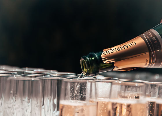 Champagne flutes being poured