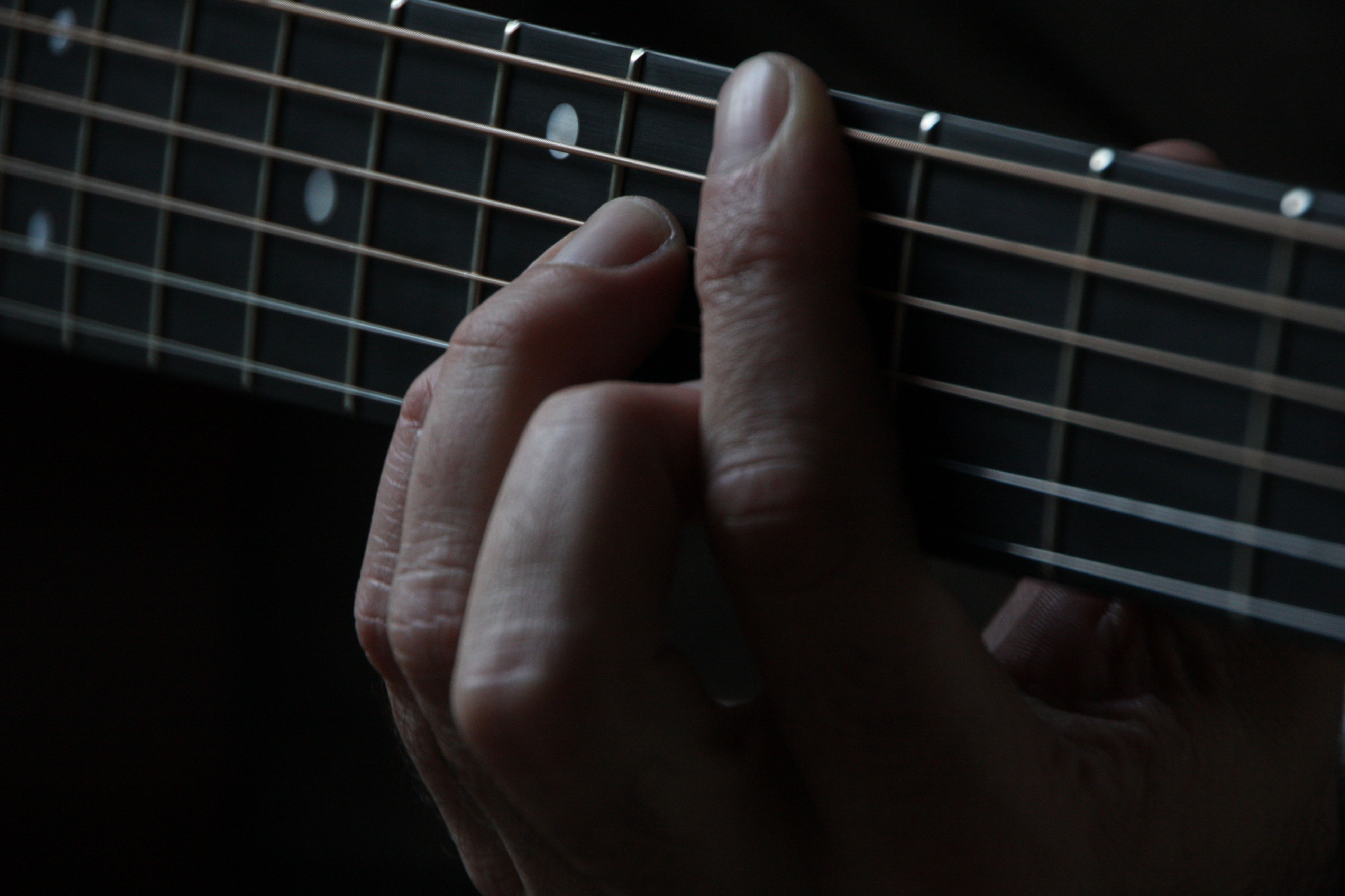guitarist playing a chord