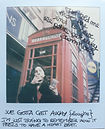 Person by a london phone booth