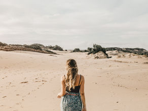 Individual reconnecting with self-worth after heartbreak and learning to stop seeking validation from others.