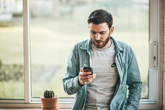 Man looking at a website on a mobile phone