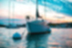 Ride a boat in the bay at sunset