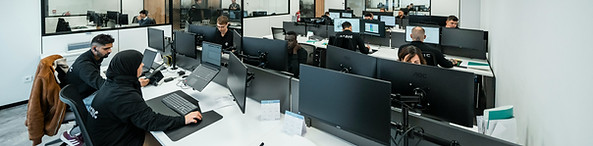 Professional team of healthcare RCM experts working in a modern operations center to process medical billing claims.