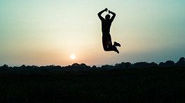Man jumping while on mountain