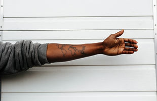 Image of an arm with a world map tattoo stretched out. This image invites visitors to contact 3PV Consulting at info@3pvconsulting.com