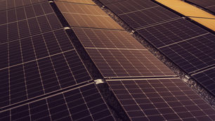 Large warehouse rooftop covered in commercial solar panels
