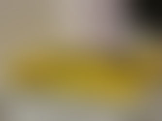 Yellow book kept on a rack with the title "Unlearn"