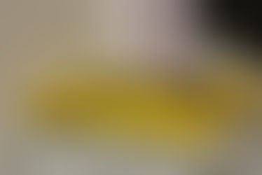 Yellow book kept on a rack with the title "Unlearn"