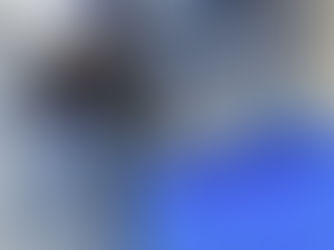 Image of a spray foam installer holding a spray gun.