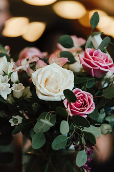 Image shows a white and pink rose bouquet.