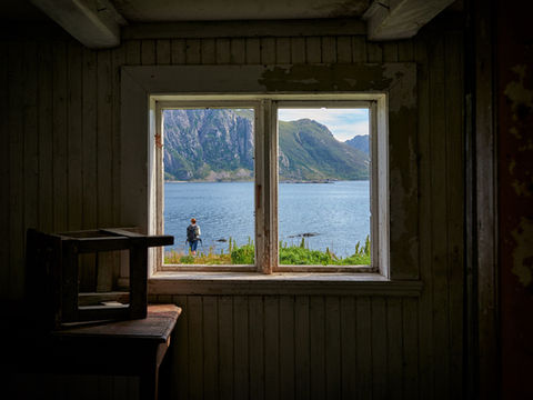 Physical window frame and through it a calm path symbolizing emotional regulation and returning to balance. Symbolic of window of tolerance.