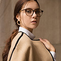 woman with glasses looking confident