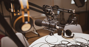 Microphones, headphones, and other podcast equipment.