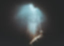 light streaming into a chasm underground Tom Williamson