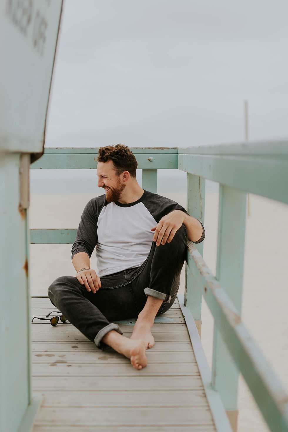 A man at the beach smiling
