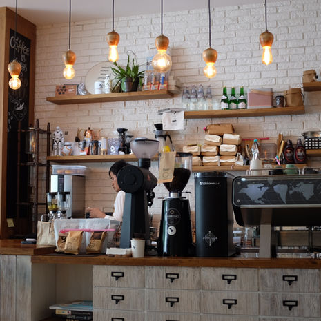 retail and commercial coffee shop with a sign on the wall that says coffee