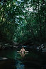 Empowered woman standing in clear Costa Rican waters
