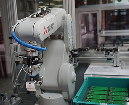 Robotic arm in an industrial manufacturing facility