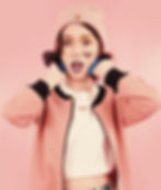 Girl with butterfly face tattoo wearing a carhart hat ad pink broided jacket