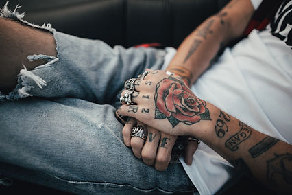 Consultation between a patient and a laser technician discussing personalized tattoo removal plans.
