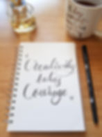 open notebook with the words "Creativity takes courage" written on the page