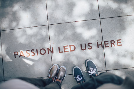 Future ThinkWell CBT clinicians looking down at sidewalk that says 'Passion Led Us Here'