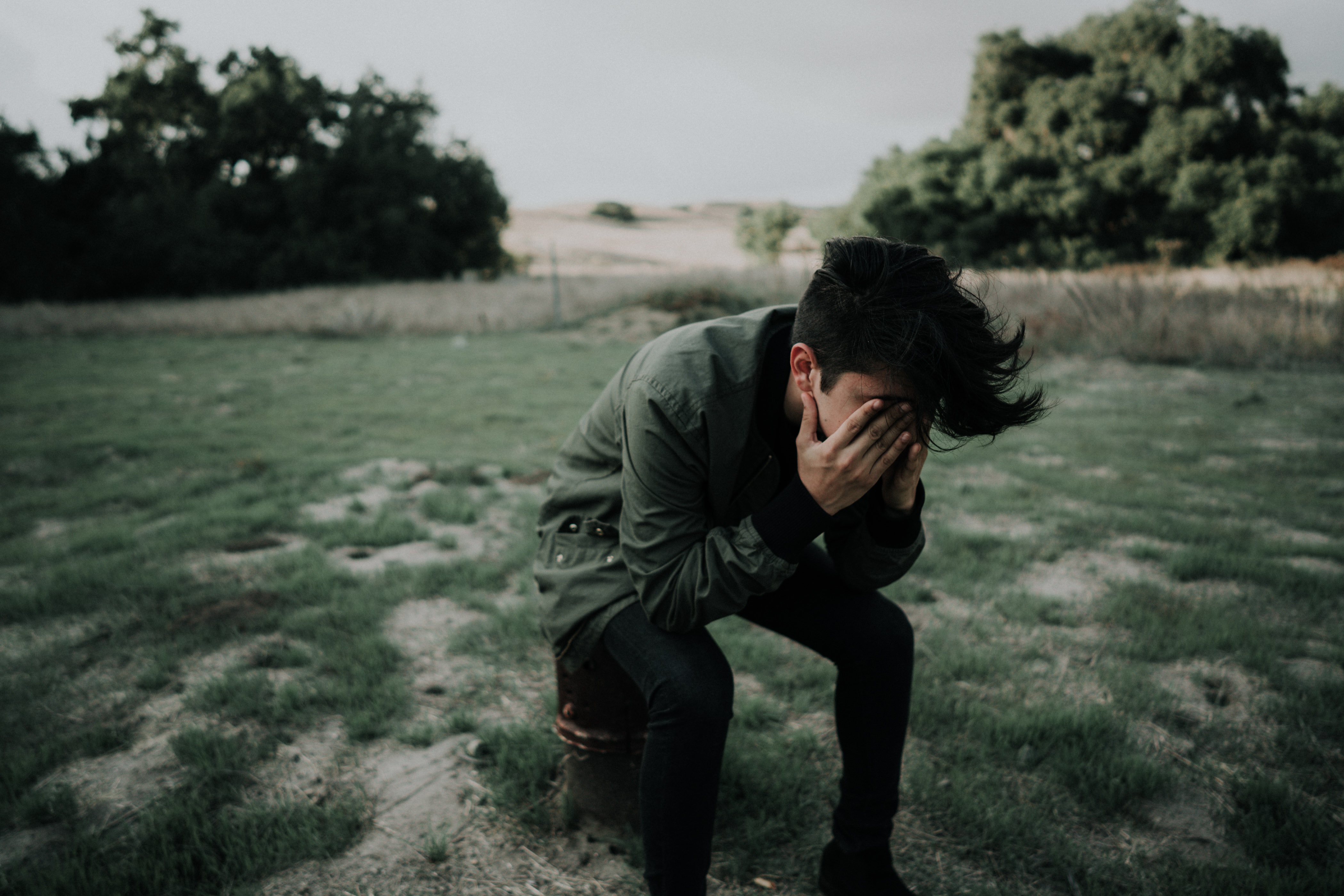 Man holding his head in shame