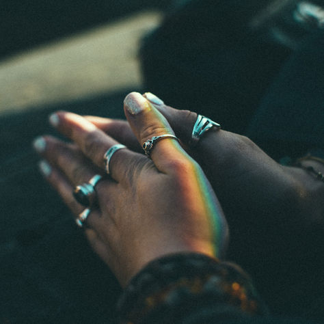 A peaceful moment of reflection: a woman with her eyes closed and hands gently clasped in prayer, surrounded by warm morning light, symbolizing overcoming fear through faith and prayer.