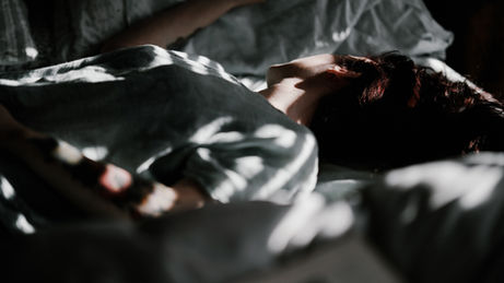 A person sleeping in bed at night 