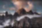 Majestic mountains shrouded in mist at sunset