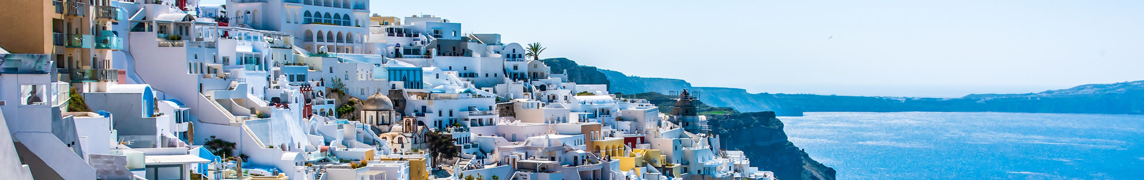 Sunlit islands and ancient ruins with whitewashed villages, coastal beaches, and historic landmarks, highlighting Mediterranean culture and landscapes