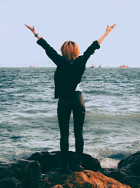 woman standing by the sea
