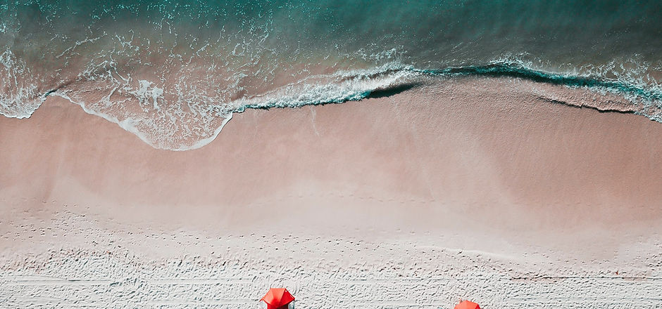 Surf on the beach from above. Image by Alex Perez