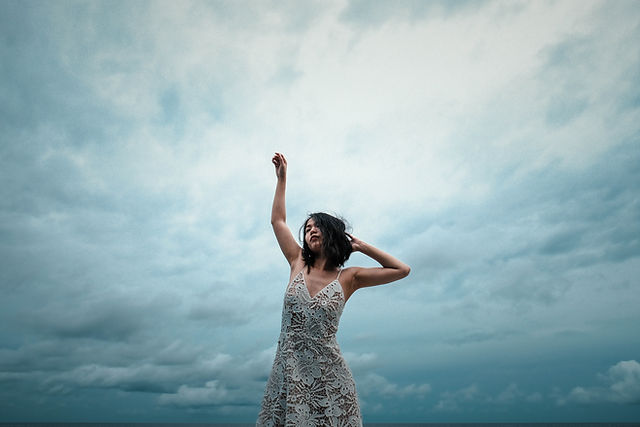 Woman who is renewed practicing self-care.