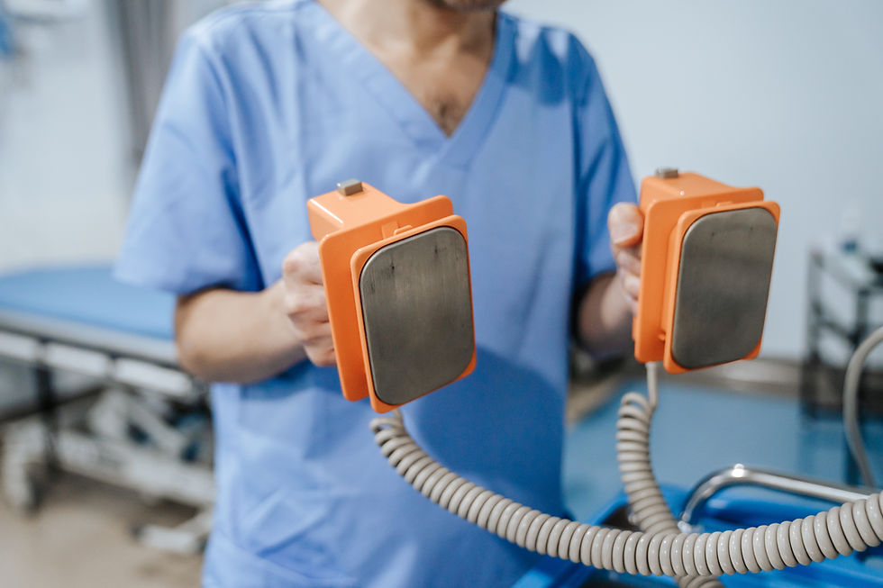 A nurse holding a defibrillator