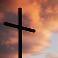 cross in front of clouds
